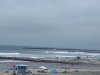 A less crowded stretch of beach, with lifeguard, is next to and in front of the complex.