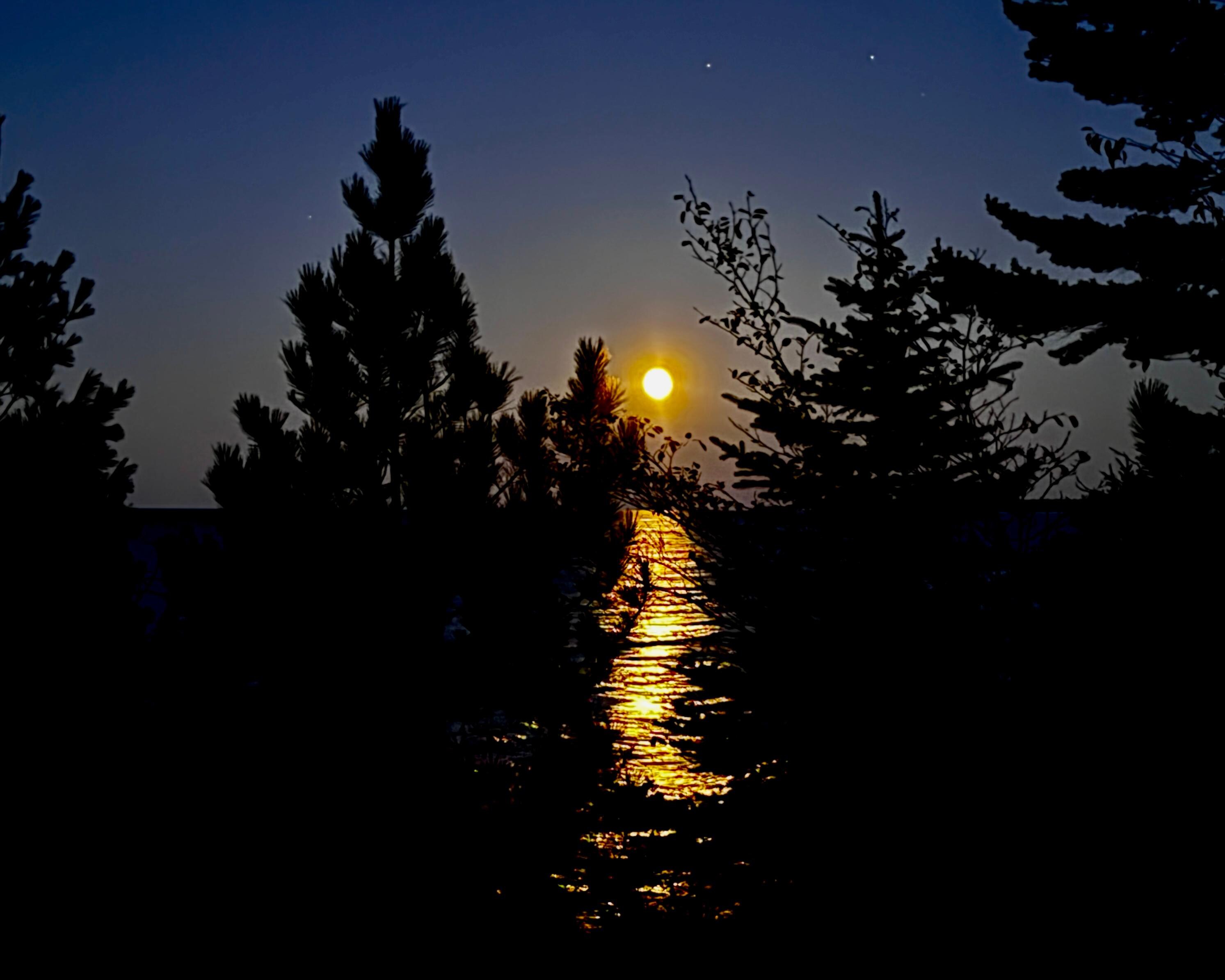 The moon is rising over Lake Superior. 