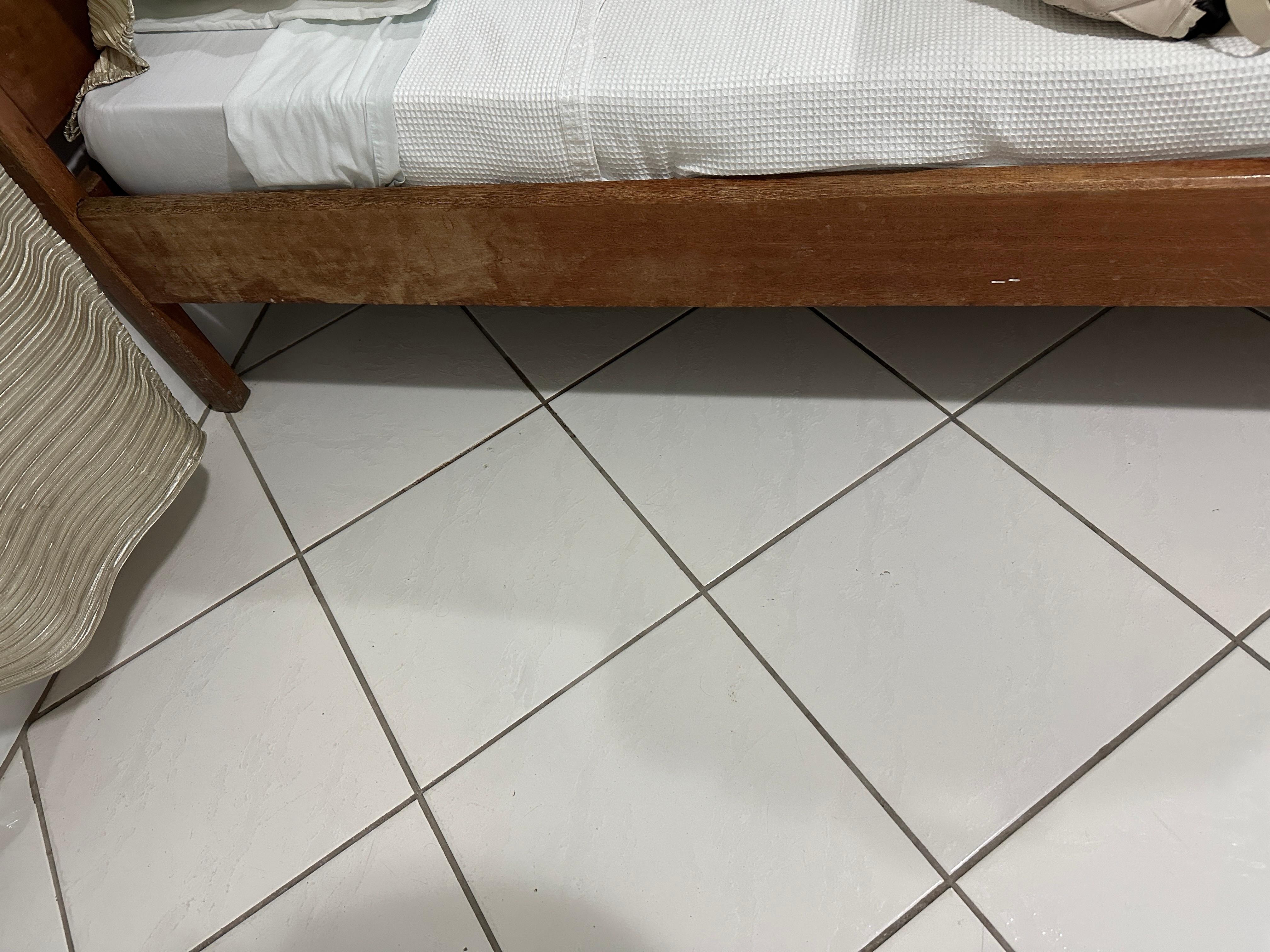 old bed frame with stains 