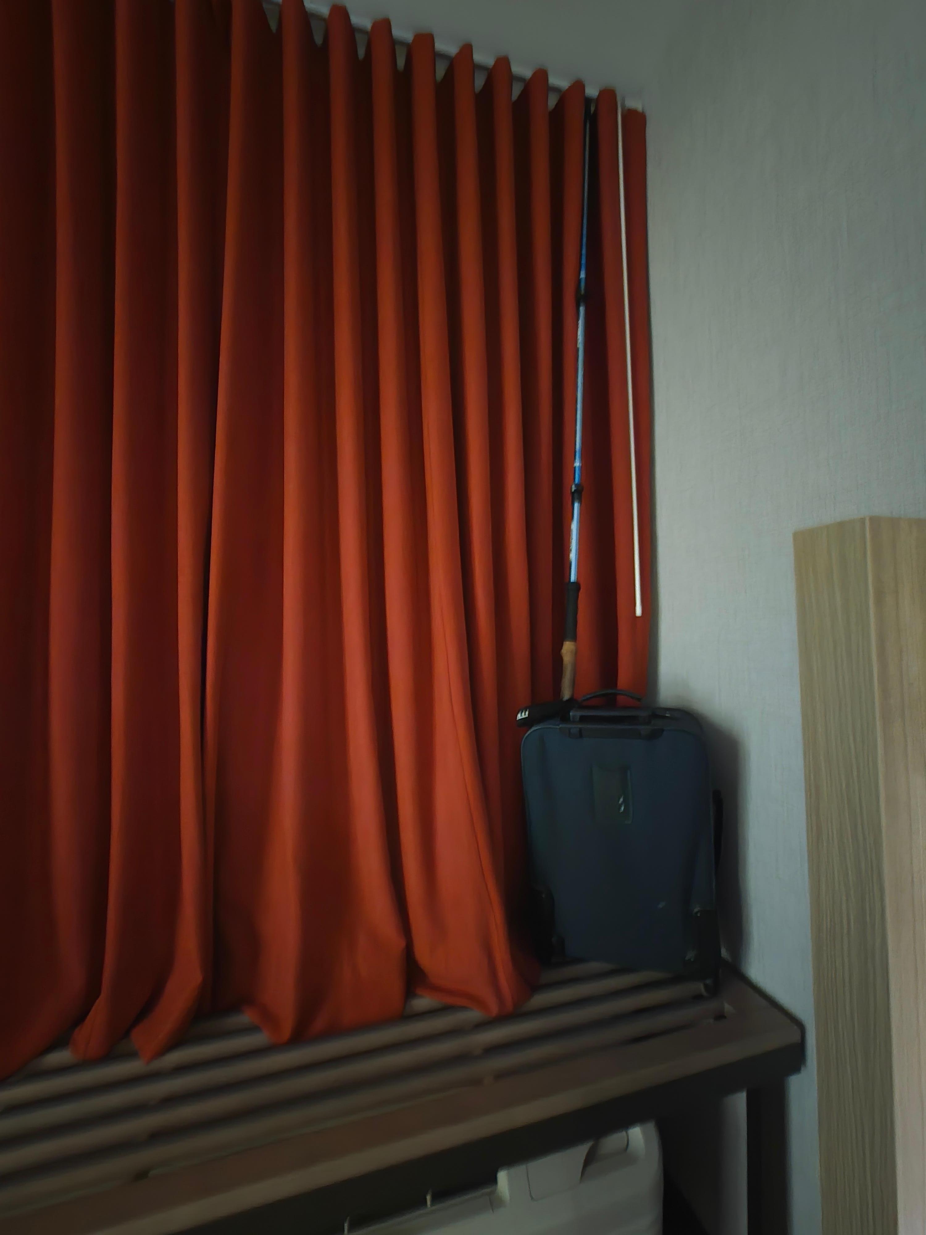 Drapes rod propped up to close