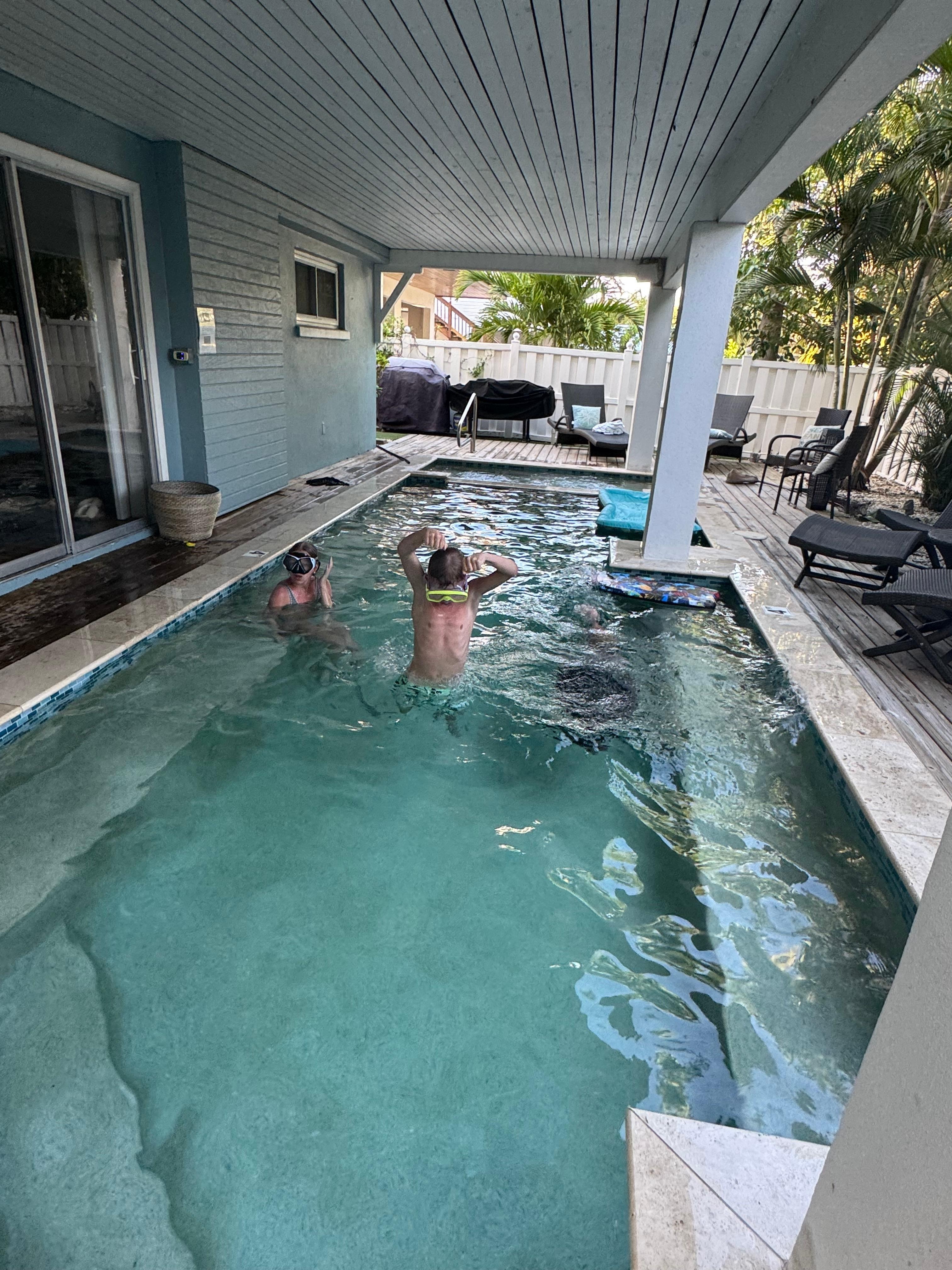 Covered pool and spa area in the back