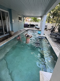 Covered pool and spa area in the back