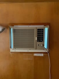 Knob missing from a very old AC unit that has a clogged filter.