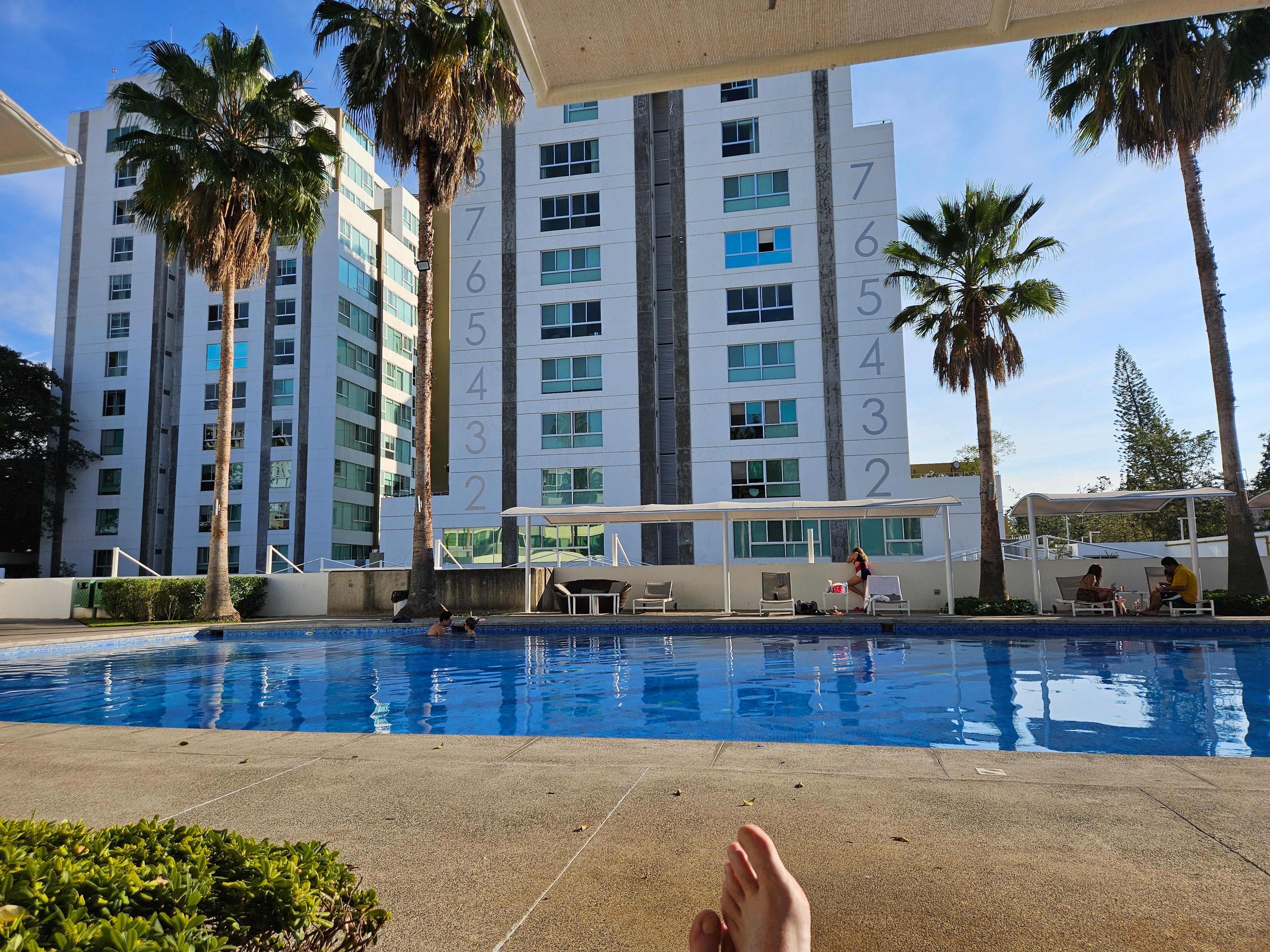 Large pool with shade covers to relax