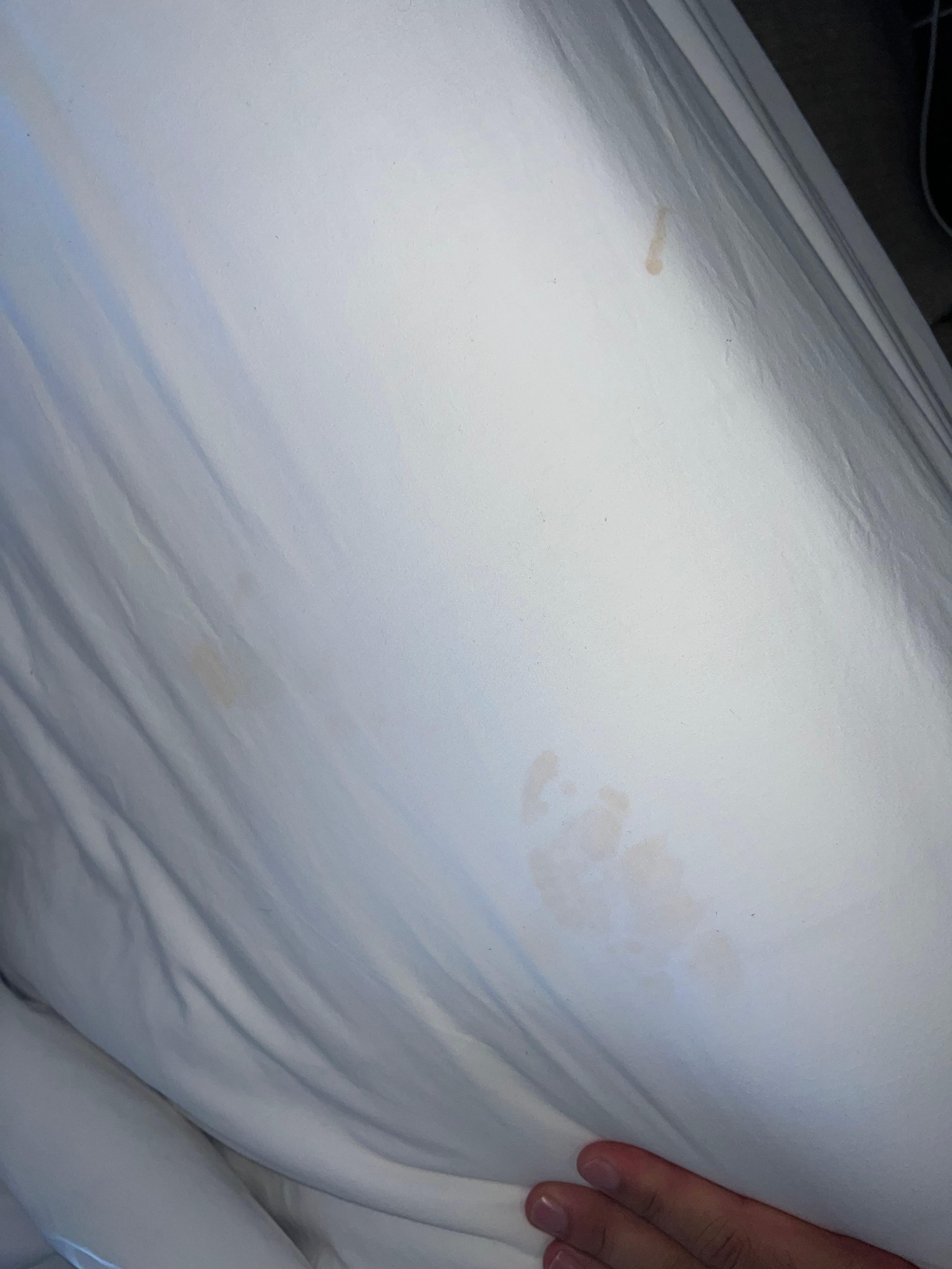 Some type of fluid stain on sheets