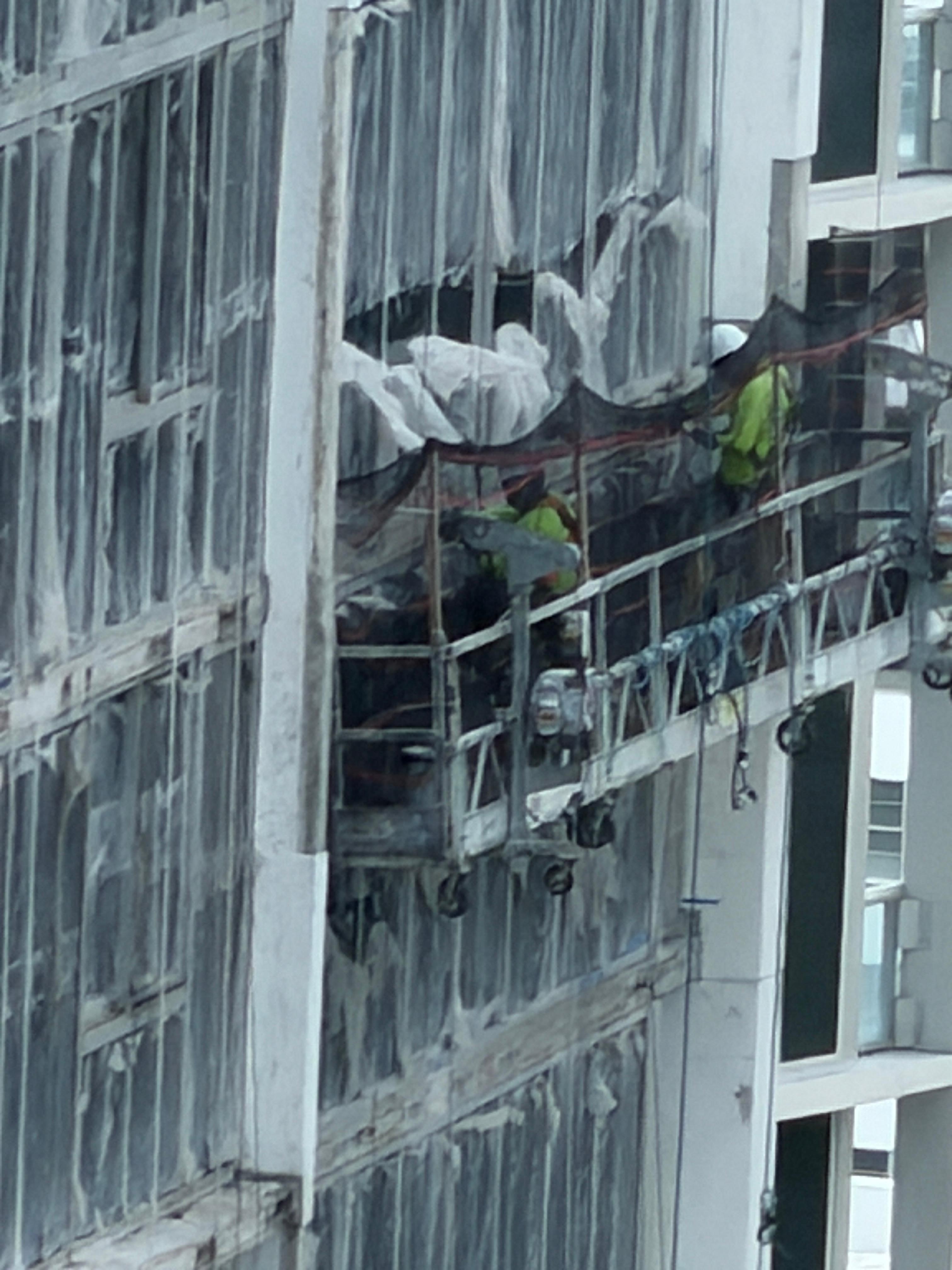 This photo better shows the window film in the daylight, but this is the building in front of the unit! 