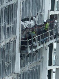 This photo better shows the window film in the daylight, but this is the building in front of the unit!