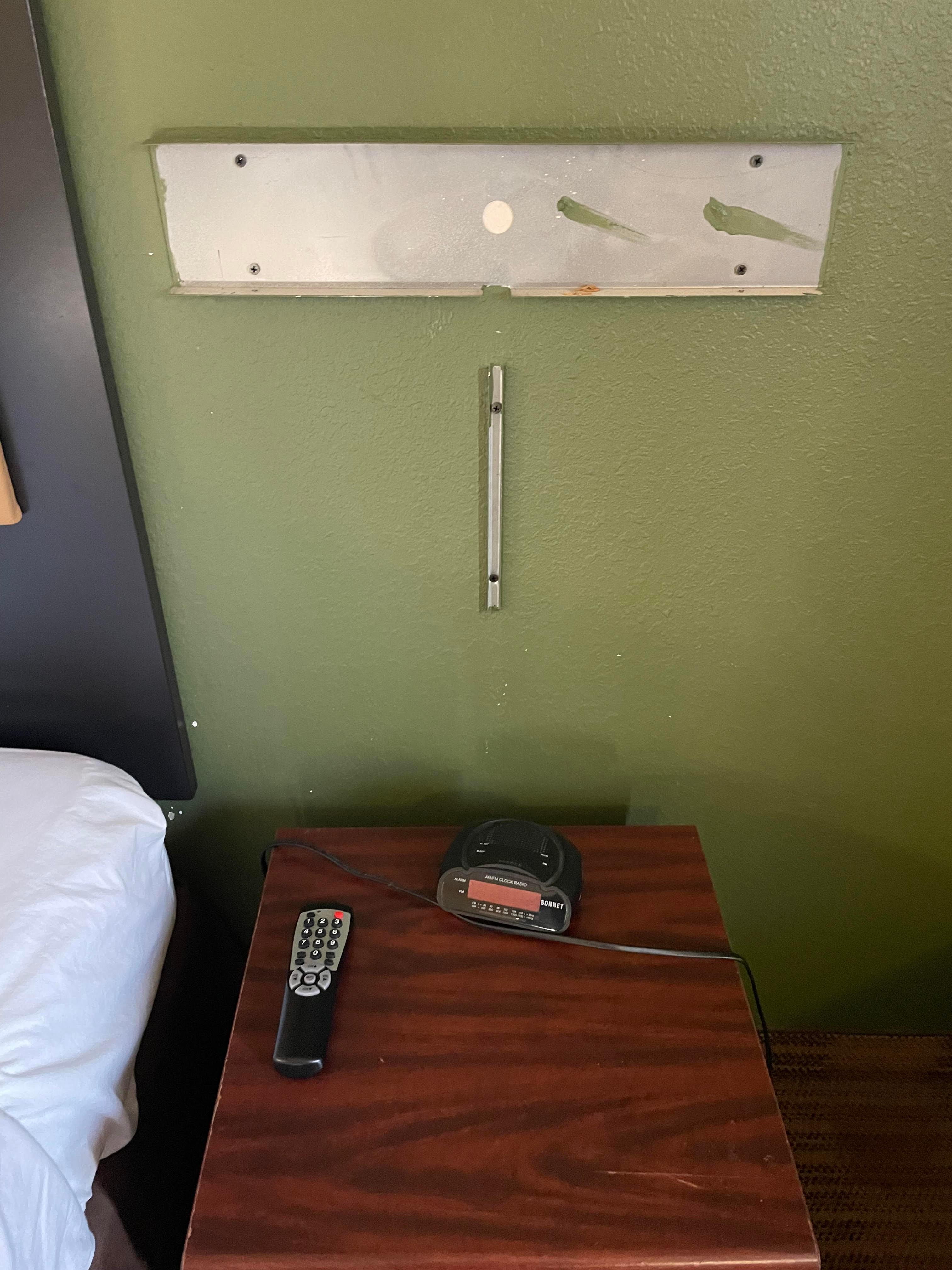 No bedside light either, but at least it's only sharp, exposed metal, not exposed electric wires!