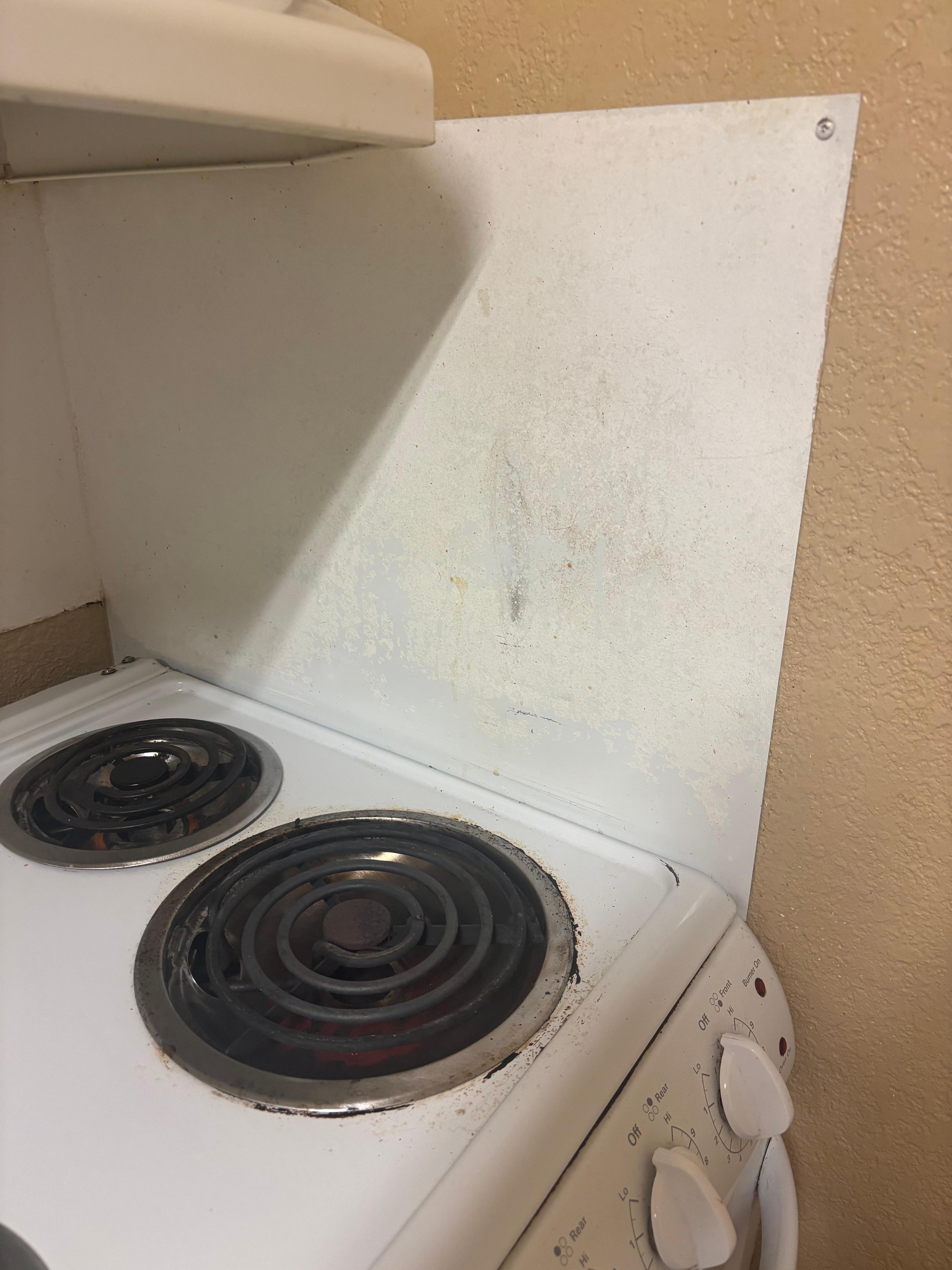 Old and scratched up kitchen area