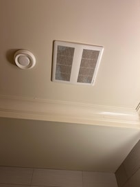 Ceiling vent in bathroom - caked in dust and allergens. Obviously the air filter has never been changed. HUGE health hazard.