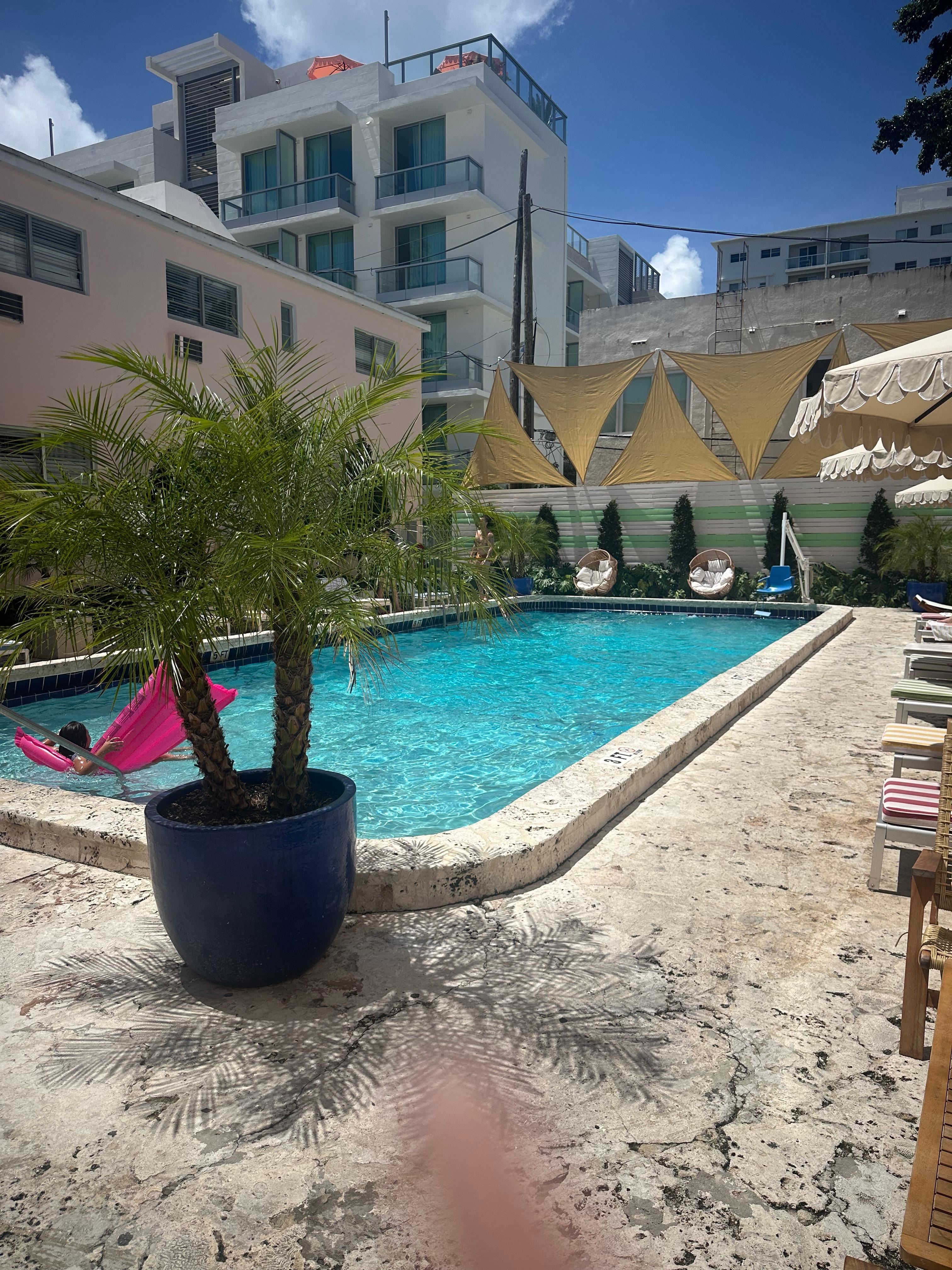 Pool area behind restaurant in building on the right. 