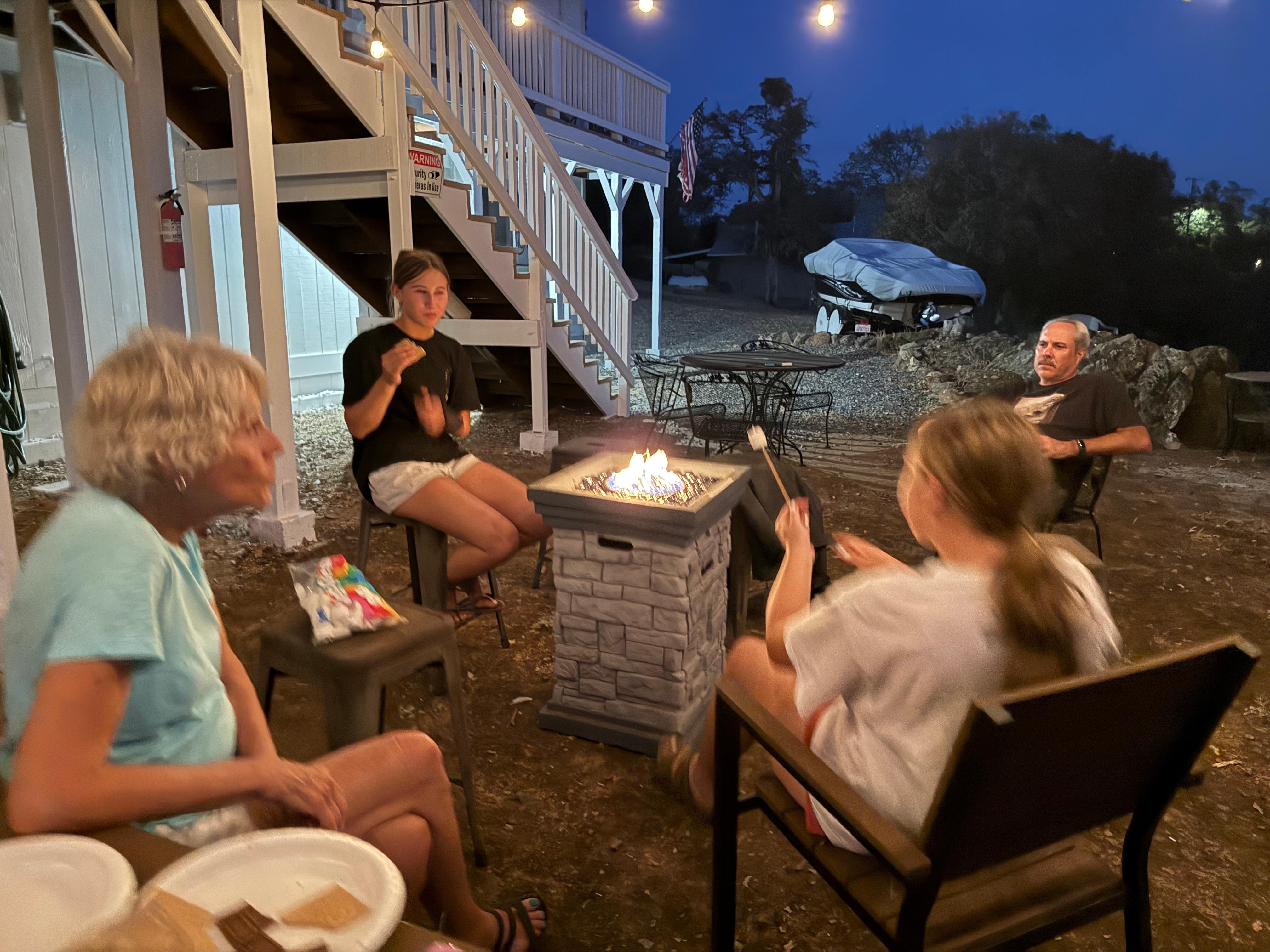 S’mores were happening at the fire pit. 