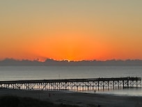 Sunrise behind low-hanging clouds