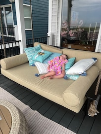 Huge swing bed on the back porch.