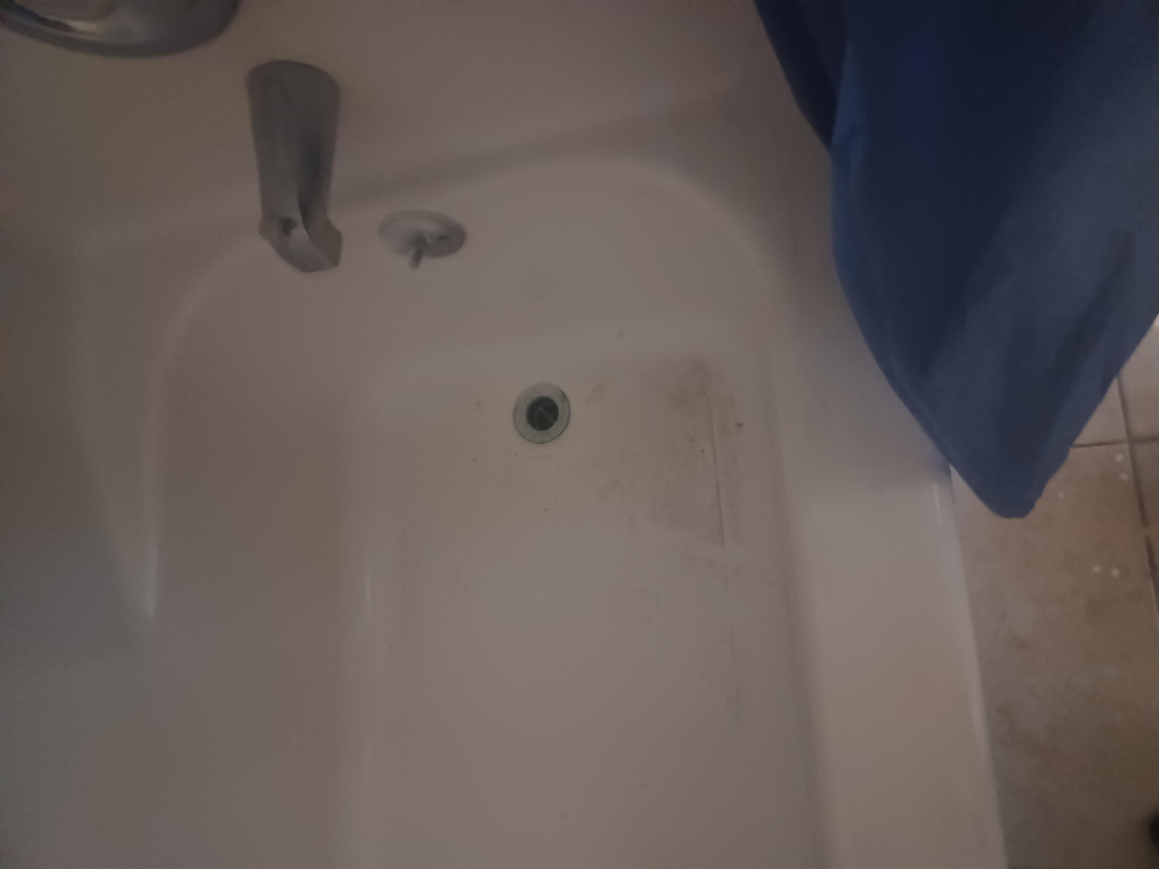 This is the filthy Tub with no water coming out of it , take a shower 