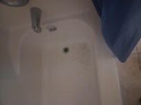 This is the filthy Tub with no water coming out of it , take a shower