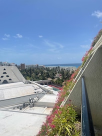 Balcony room view to partial beach