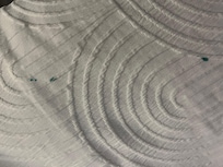 Green paint stain on bedding