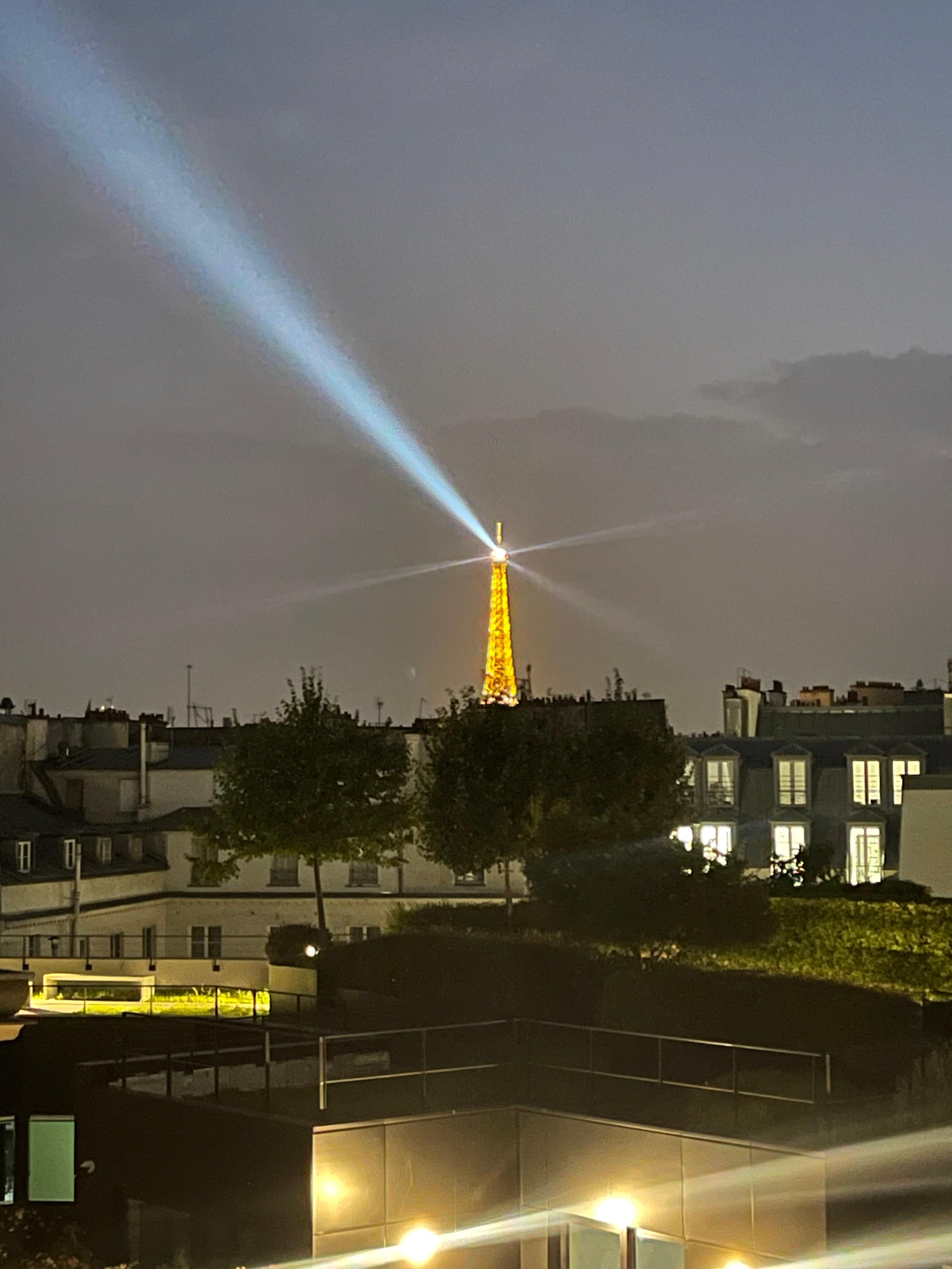 Zoomed in view of Eiffel Tower from the room. 