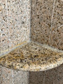 The whole shower and bathtub area has major corking