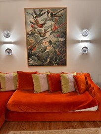 L-shaped couch converted to two single beds that were already made up. Lots of pillows for sleeping were provided as well.