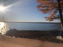 Morning view from my tent on an idyllic Oct morning. Drop-off to shoreline is about 2' in front of that log bench.