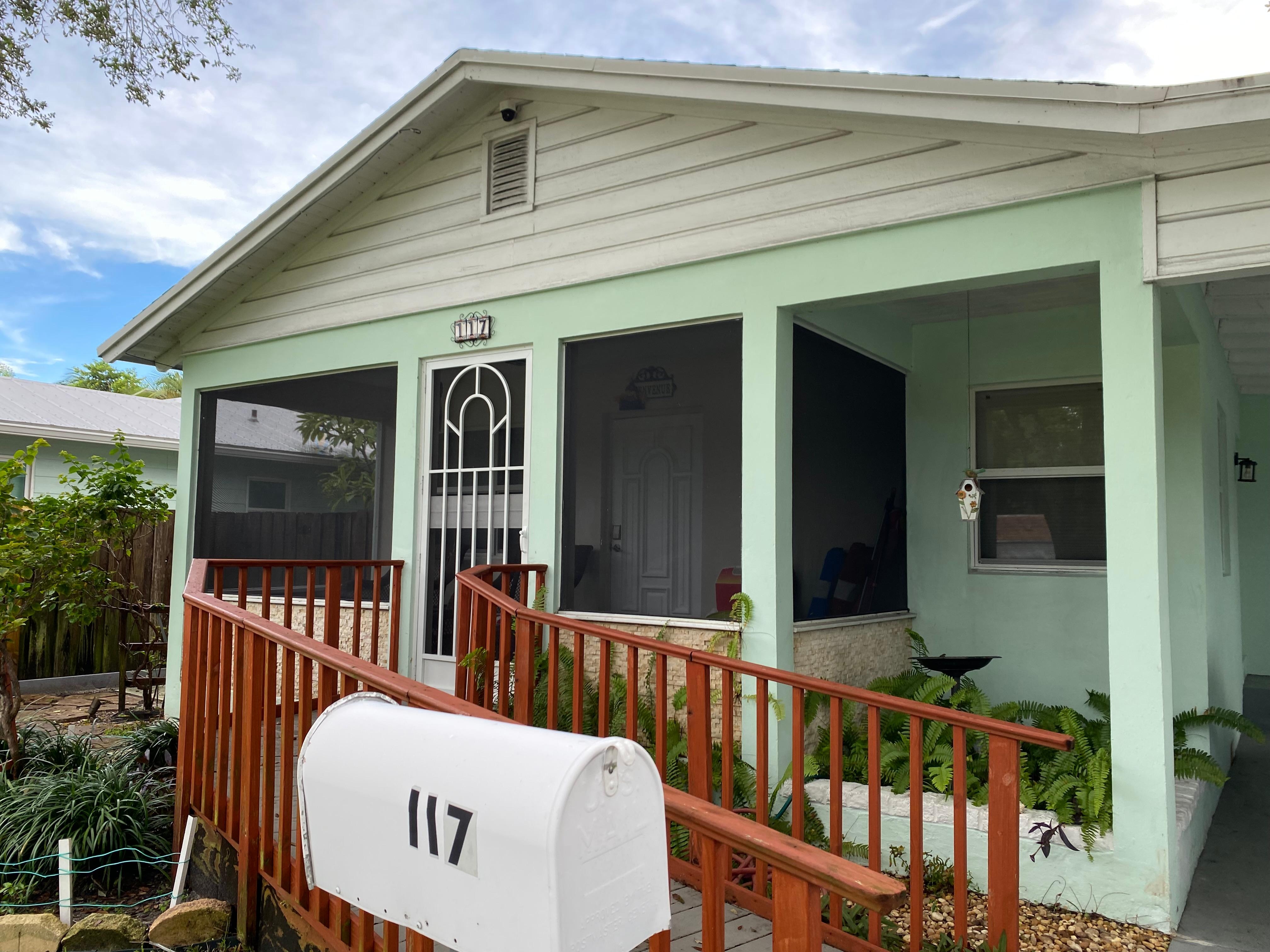 Screened in porch & ramp to front door 