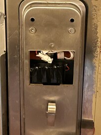 Broken door lock filled with paper