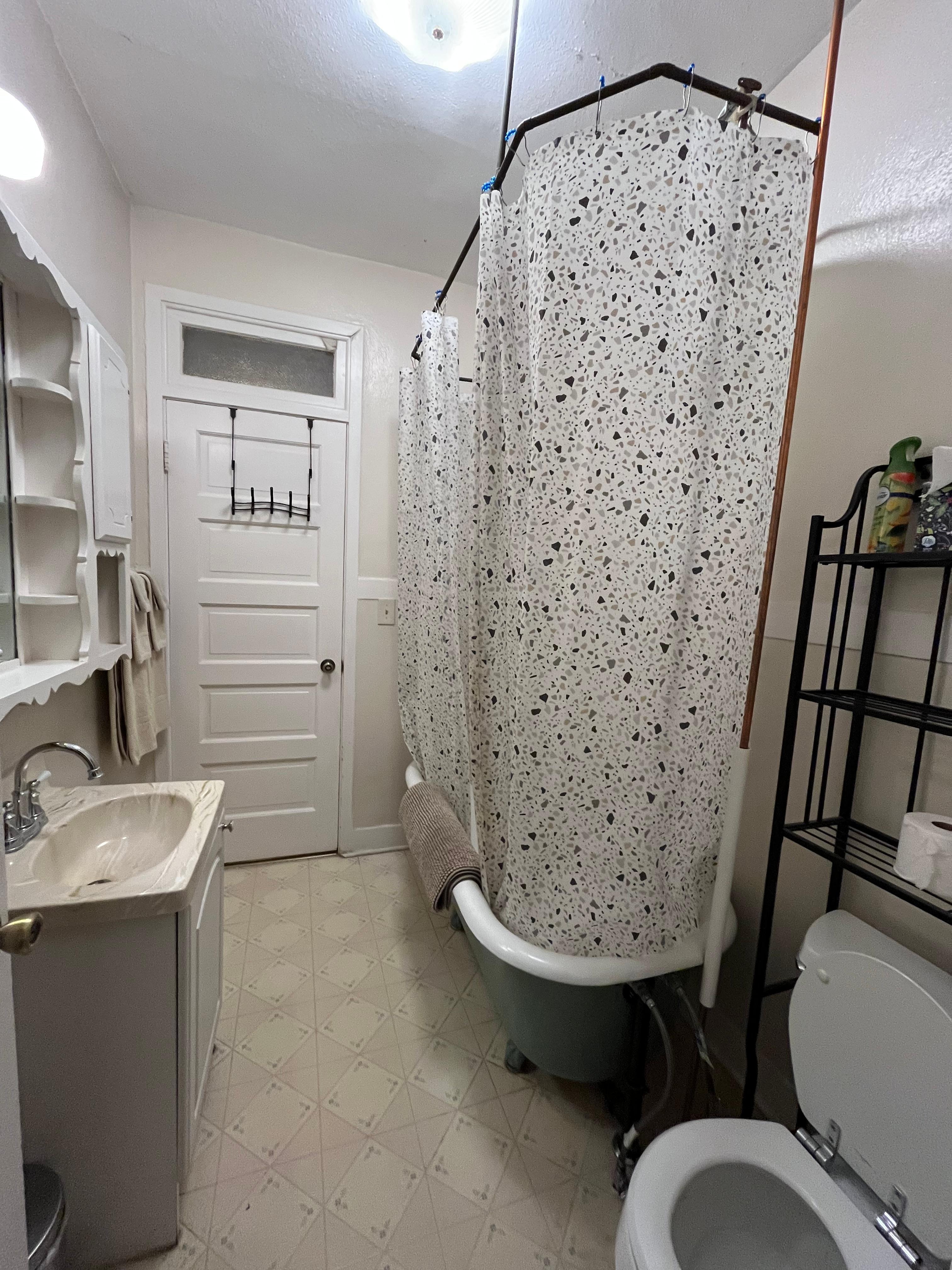 Bathroom is small but has plenty of hooks and shelves. The bath tub is a little high to get in and out of.