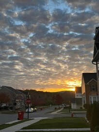 View of the Sunrise over the mountains from the front yard.