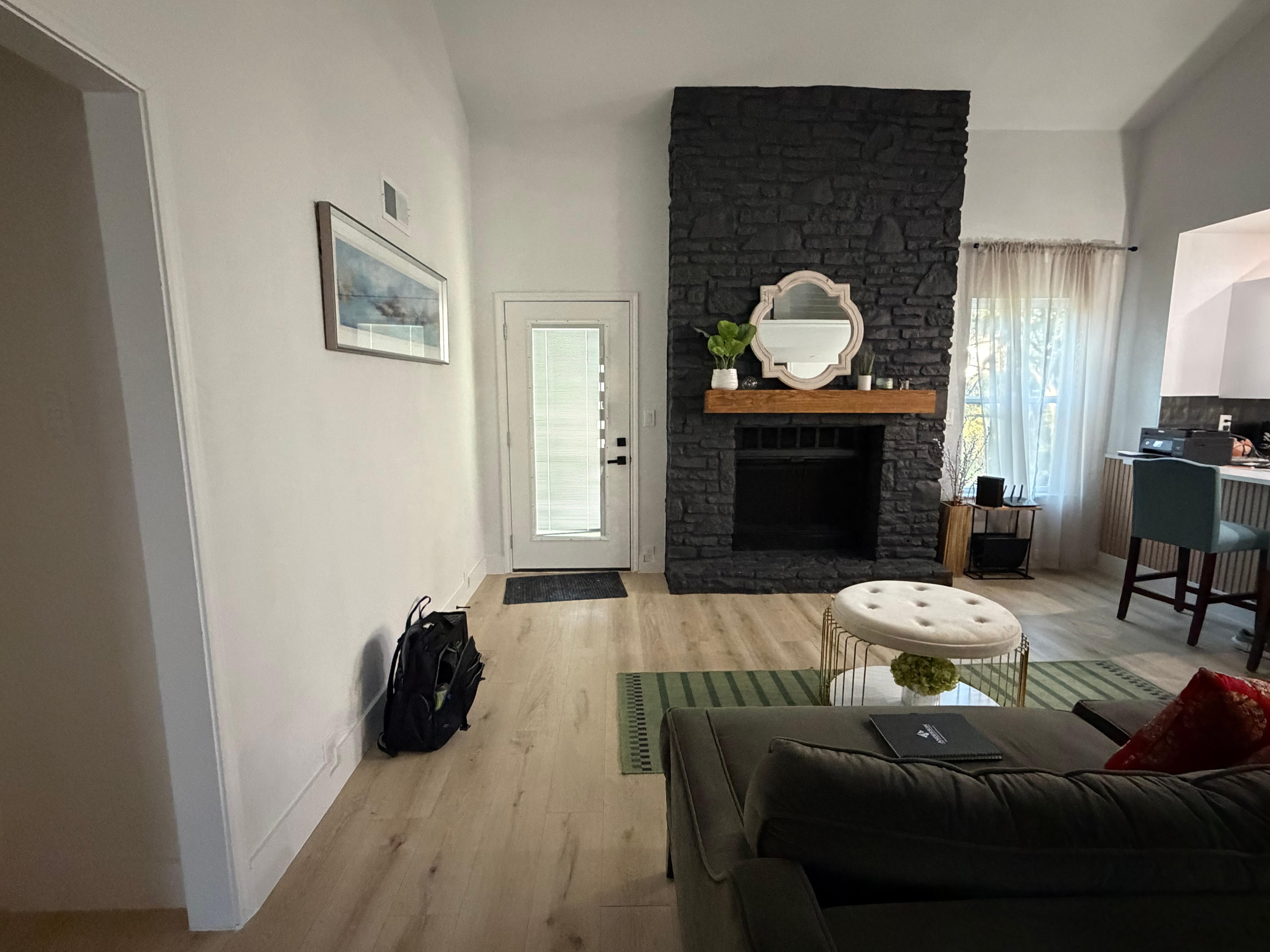 Back living room where we expected a TV to be per the listing description.