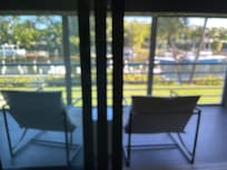 Lovely porch looking at the water & pretty boats!