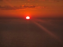 Sun peeping up over the horizon