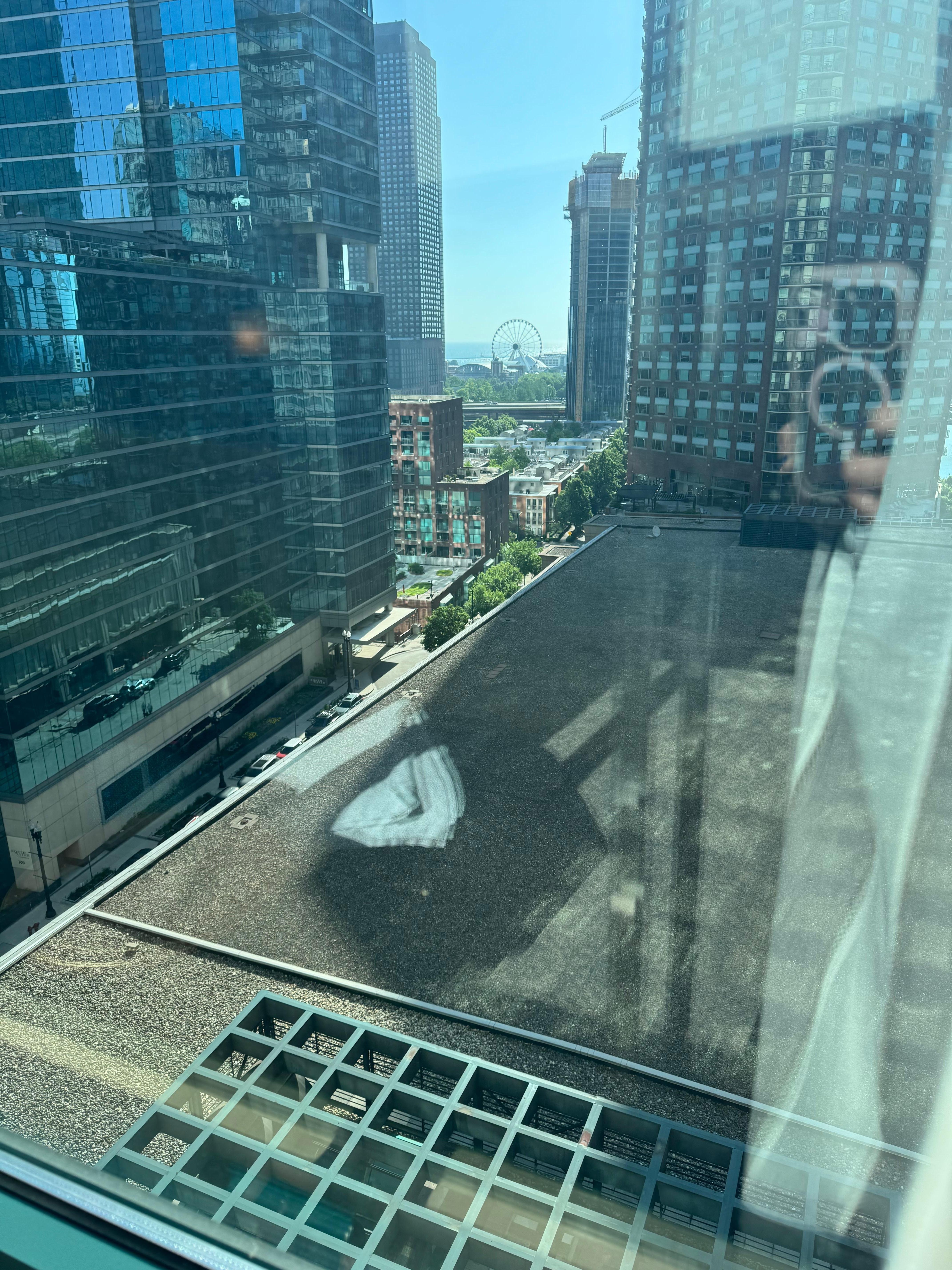 See that tiny little speck of “lake view” past the rooftop and other buildings? That our million dollar “lake view”.