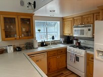 Well laid out kitchen to interact with guests while cooking