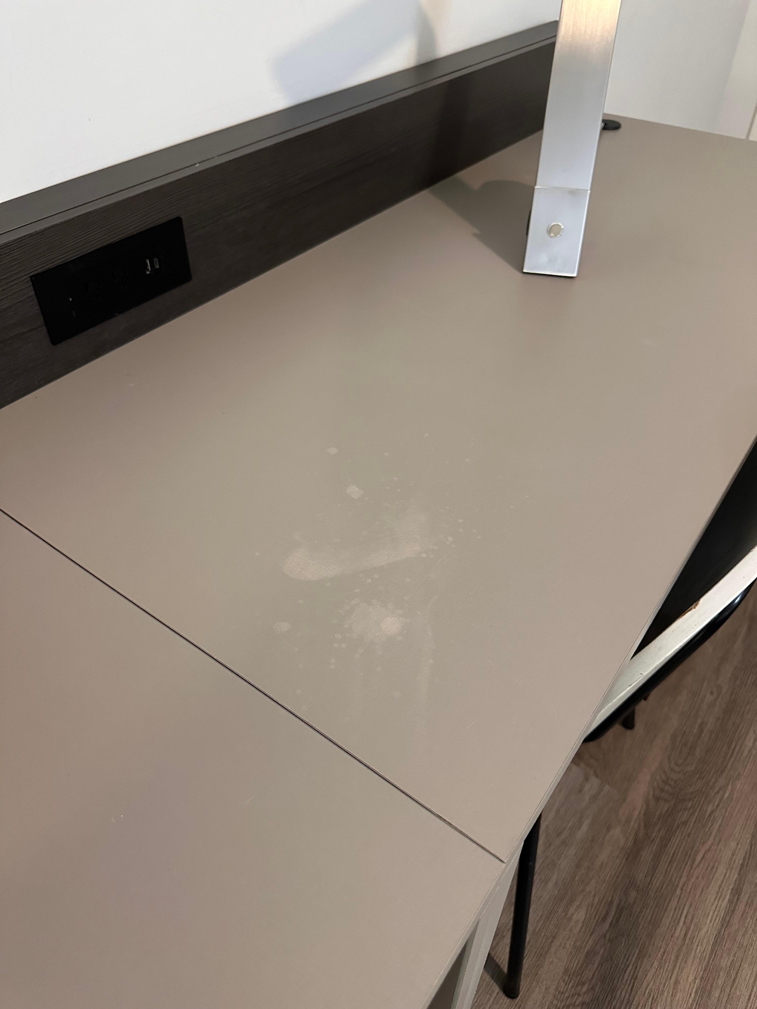 Stain on desk area. 