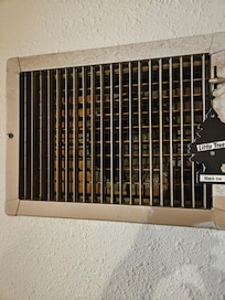 Open vent,  12" duct, could smell the cigs next door