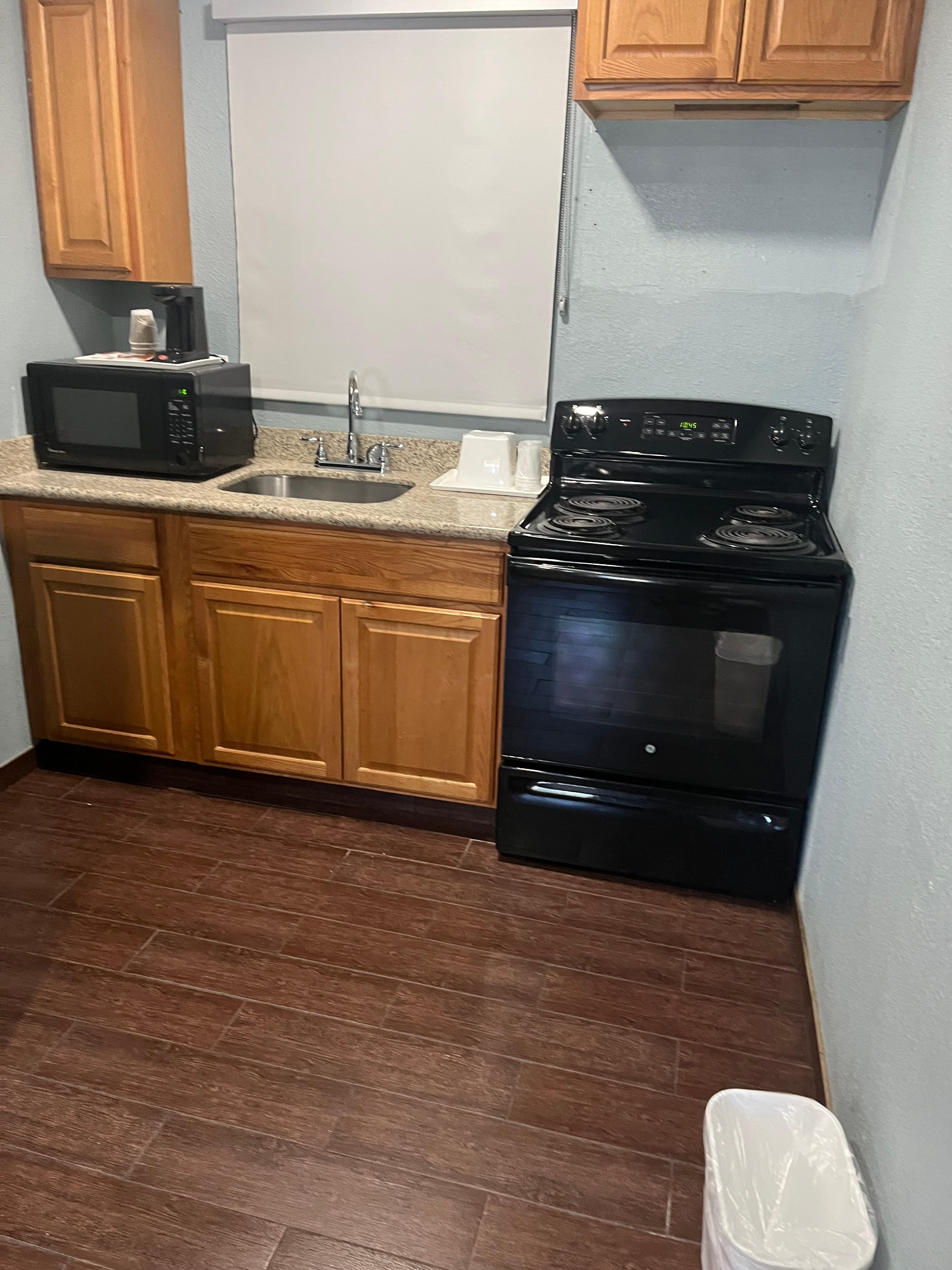 Large Kitchen with 4 Burner Stove, Sink, and Microwave 
