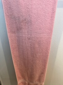 Uncleared towels hanging in one of the bathrooms