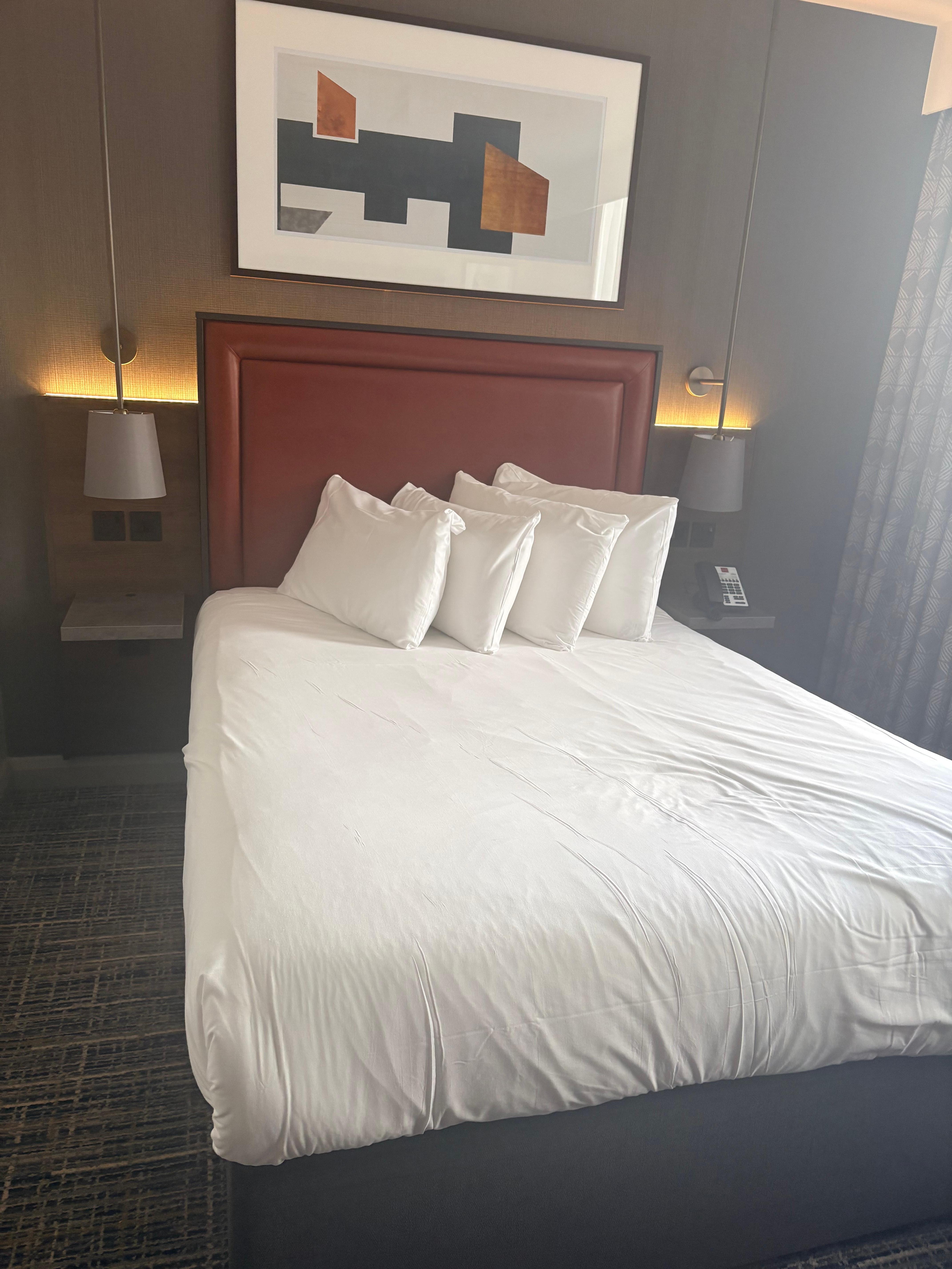 Bed with side lights and a shelf each side