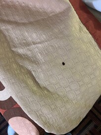 Cigarette burn on the comforter. Replace it!