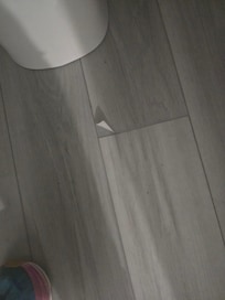 Peeling floor in master bath
