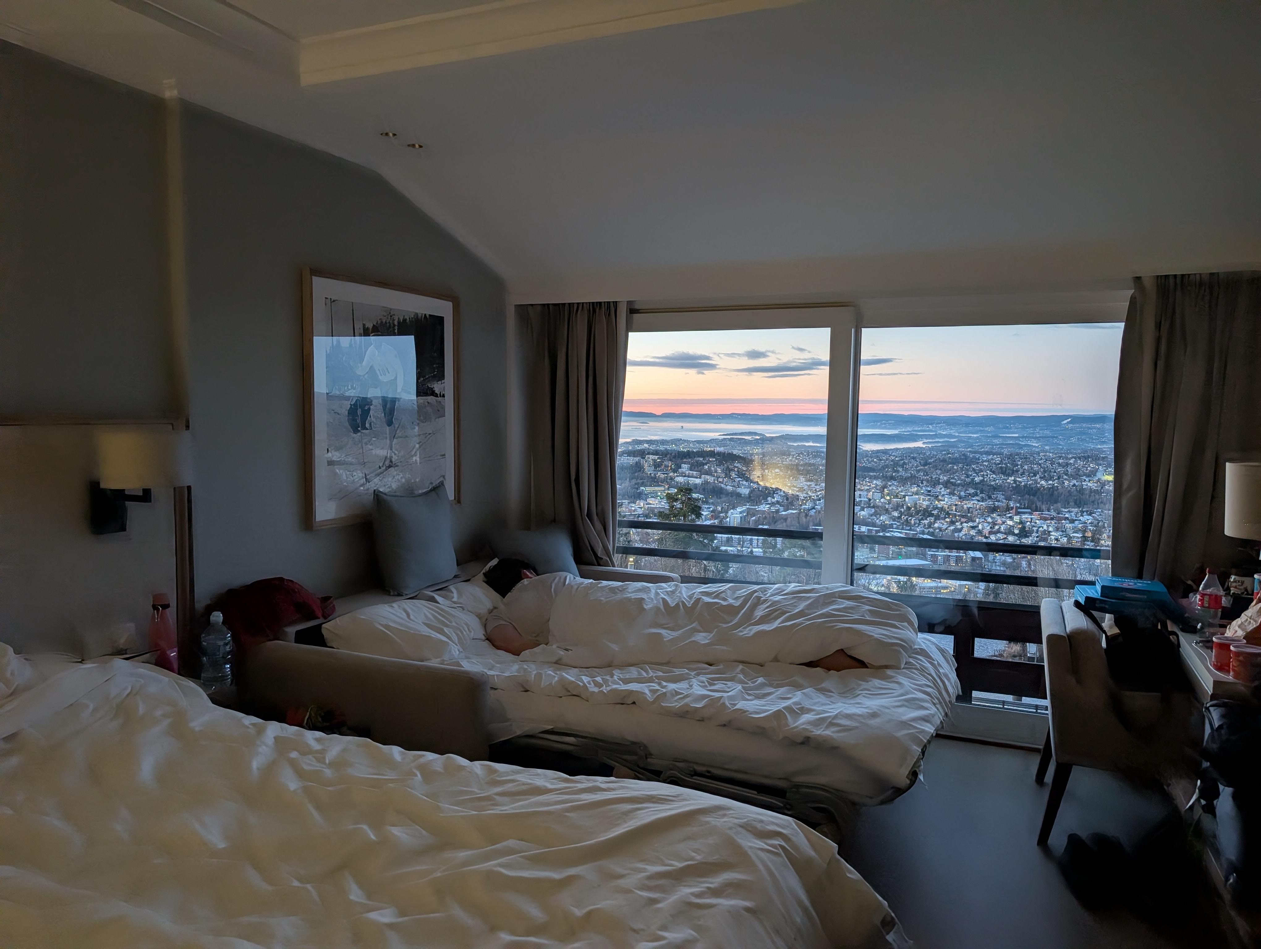 Family room with sofa bed pulled out and view over Oslo