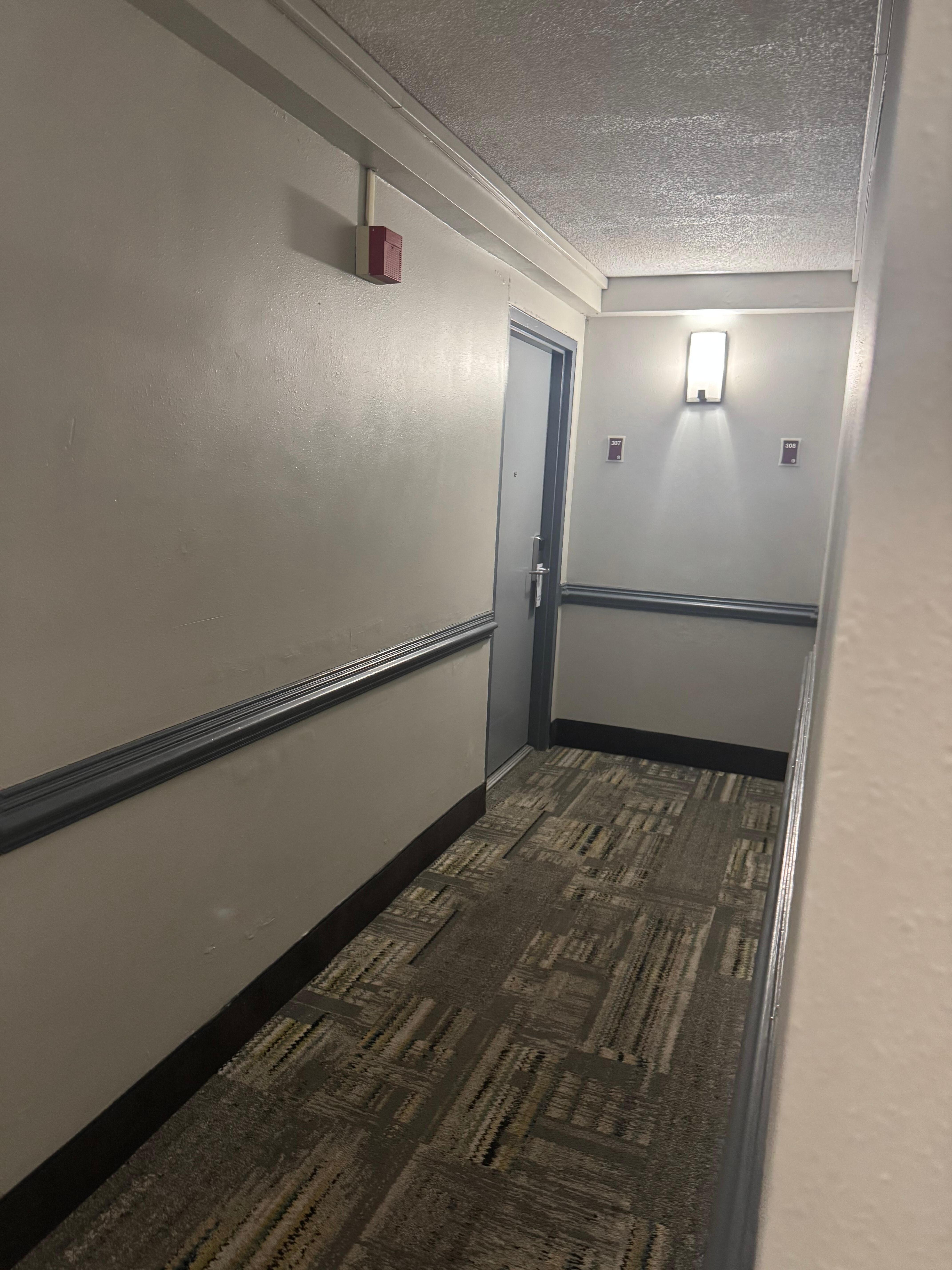 Hallway lighting is lacking. 