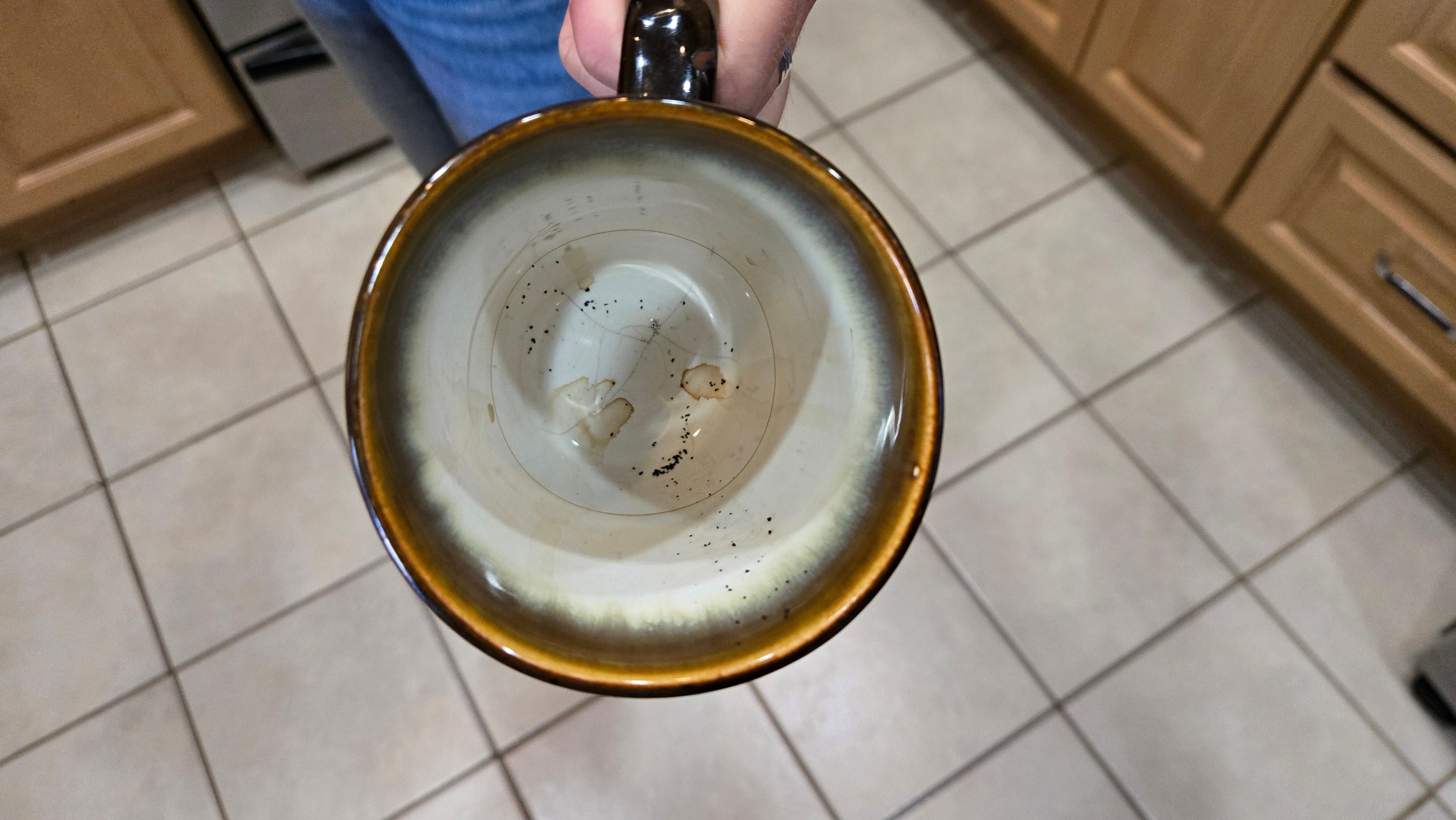 Dirty dishes in cupboard.