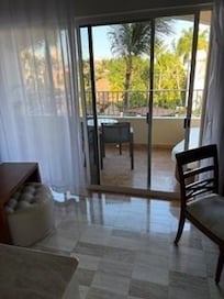 Junior Suite includes patio with lounge sofa, table and two chairs