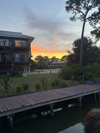 Sunset view including the back of the house from the fishing dock