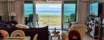 View of beach from inside kitchen/dining/living area
