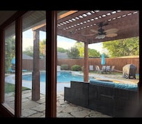 View from an outdoor enclosed porch with morning coffee.