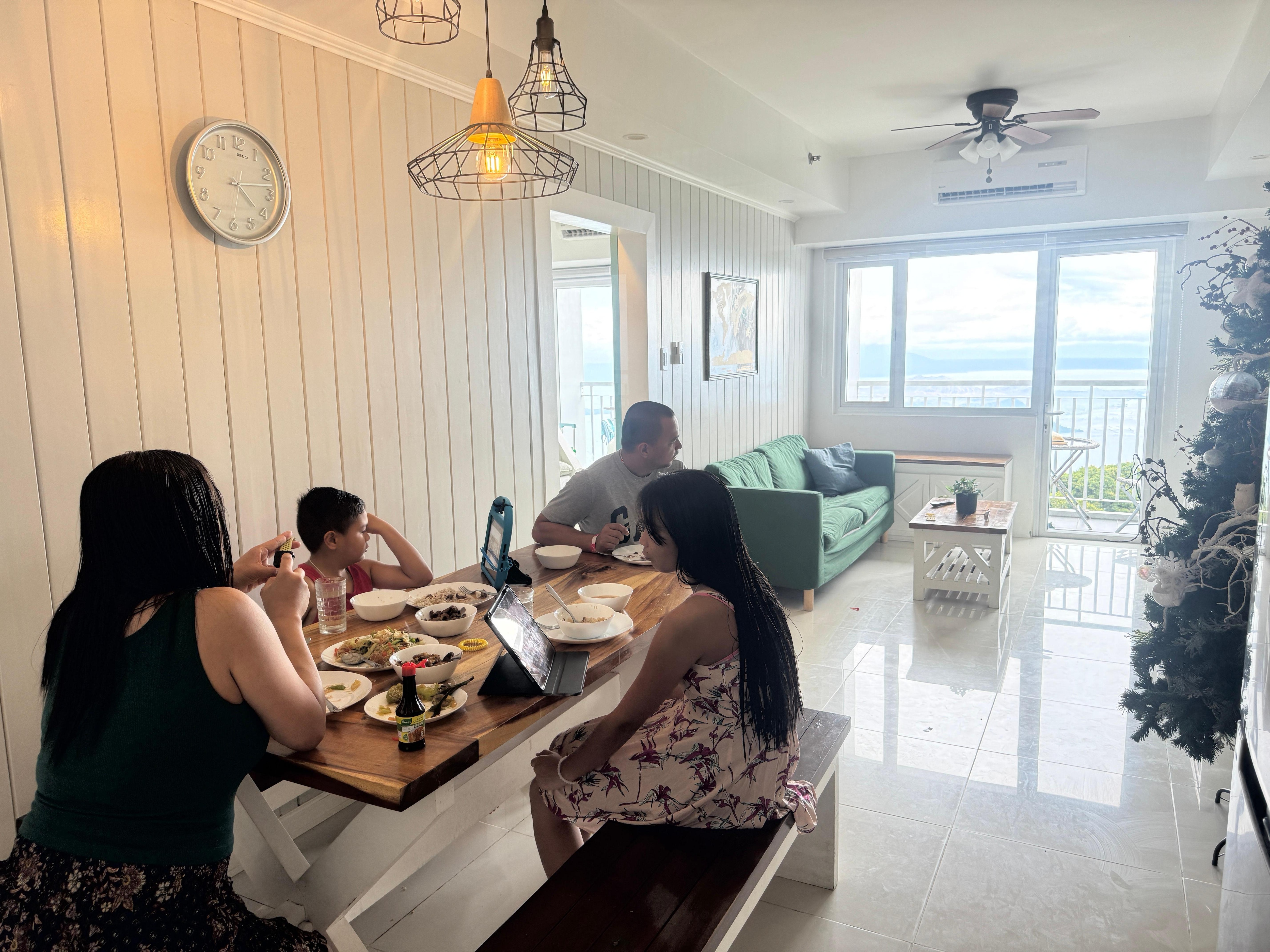 Eating our to go lunch while enjoying the beautiful view of taal lake